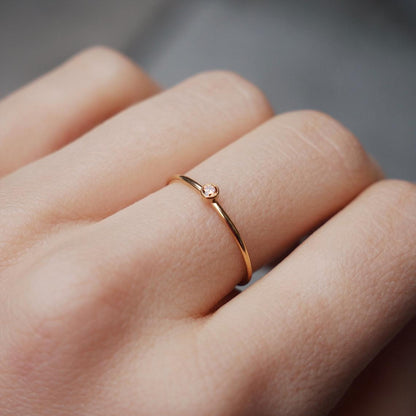 Dainty 14k gold filled November birthstone ring on model's finger by Deja Vu Apothecary